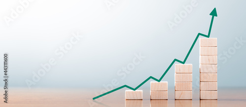 Wooden Block Statistics Graph With Arrow Showing Exponential Growth Trend photo