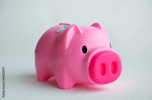 piggy bank pink color on a white background. Couple toy saving money