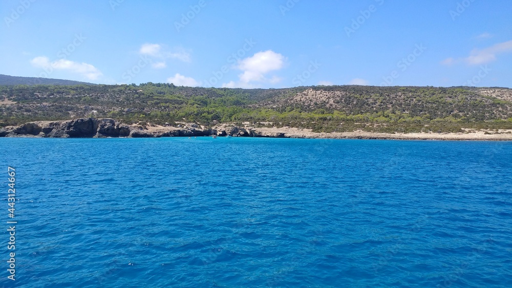 View from the sea. Blue lagoon against the backdrop of mountains and blue sky