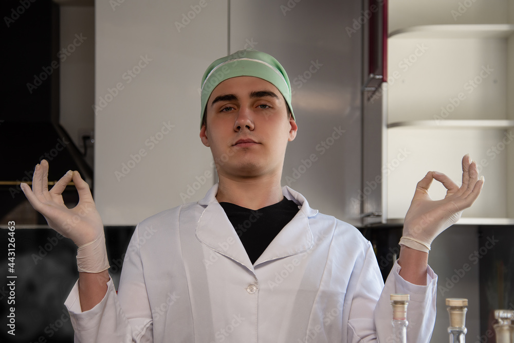 An experienced doctor is conducting an experiment in the laboratory. Viruses and scientific research. Flasks and test tubes at the mad doctor. An experienced doctor is conducting an experiment in the laboratory. Viruses and scientific research. Flasks and test tubes at the mad doctor.