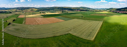 The landscape of the Werra Valley with the Werra River and agriculture fields at Herleshausen in Hesse and Thuringia photo