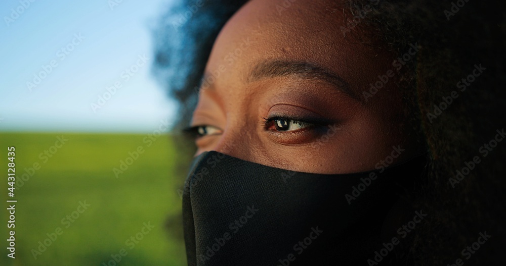 Portrait view of the multiracial professional happy farmer wearing protective mask standing in backyard of organic farmhouse and smiling with joy. Farming business and agriculture concept Portrait view of the multiracial professional happy farmer wearing protective mask standing in backyard of organic farmhouse and smiling with joy. Farming business and agriculture concept