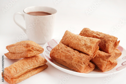 Indian khari or kharee or salty Puffy brown Snacks, served with indian hot tea, Indian Breakfast, Copy Space photo
