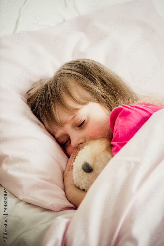 portrait of a sleeping girl on the bed portrait of a sleeping girl on the bed