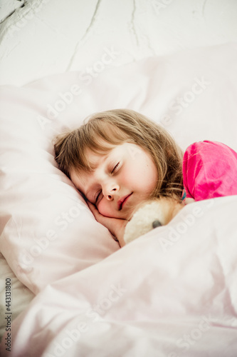 portrait of a sleeping girl on the bed