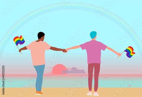 Love of two interracial men. LGBT couple of cute young people with rainbow flags are standing on the coast of ocean and admiring sunrise. Homosexual relationship