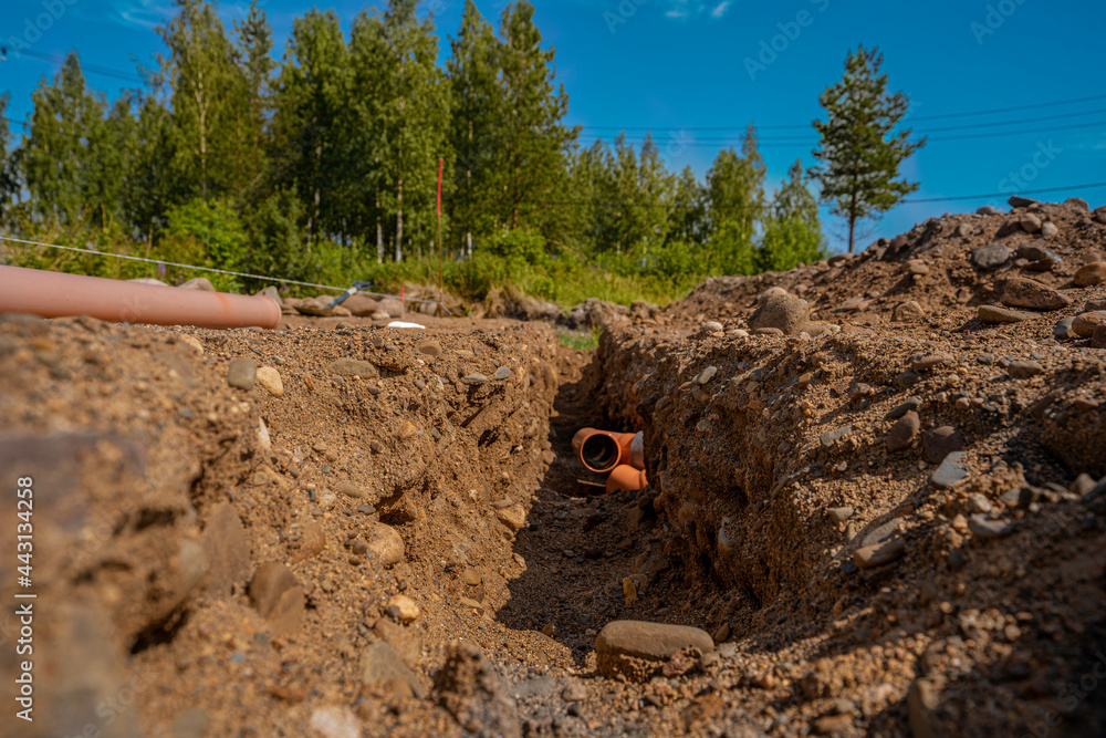 building a house, initial stages to the foundation, laying sewer pipesм - obrazy, fototapety, plakaty 
