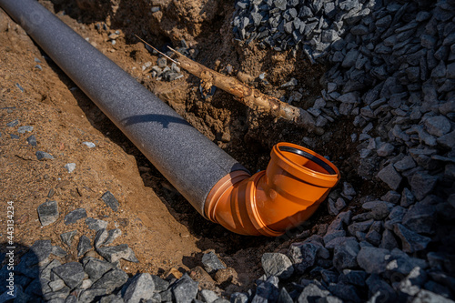 sewer pipe with a diameter of 110 millimeters in thermal insulation, laid in a trench of sand and gravel mixture