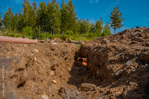 building a house, initial stages to the foundation, laying sewer pipesм