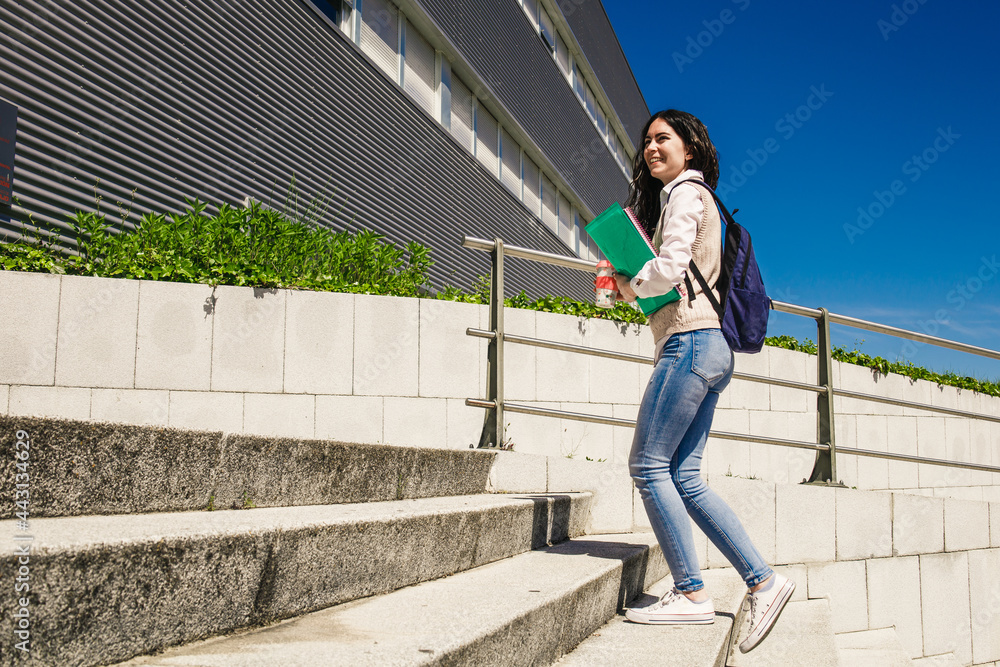 Student girl at college campus with books and coffee Student girl at college campus with books and coffee