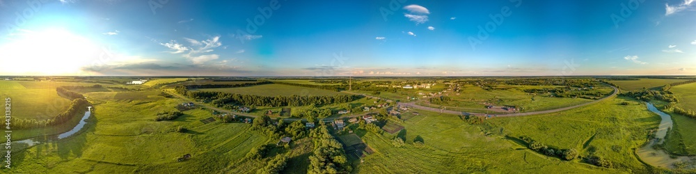 aerial panoramic landscape over the village of Bolshoi Samovets (Voronezh region, center of Russia) on a hot summer evening