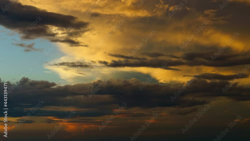beautiful sunset sky time lapse, bright sun and dark silhouette of clouds as a background
beautiful sunset sky time lapse, bright sun and dark silhouette of clouds as a background