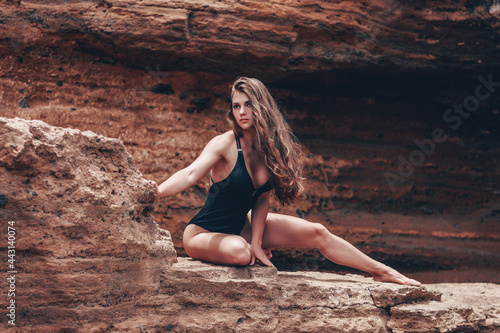 Girl in black swimming suit.