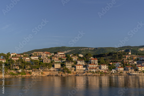 Beautiful Mediterranean town on the seafront with many white houses with red roofs © Tomasz