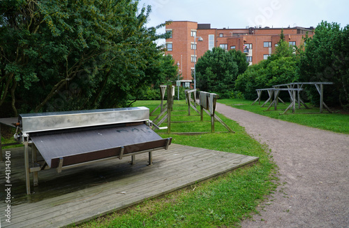 Equipment for washing, wringing and drying carpets in a residential area on the seafront in Helsinki. Washing outdoor rugs and mats is a local custom in Finland.