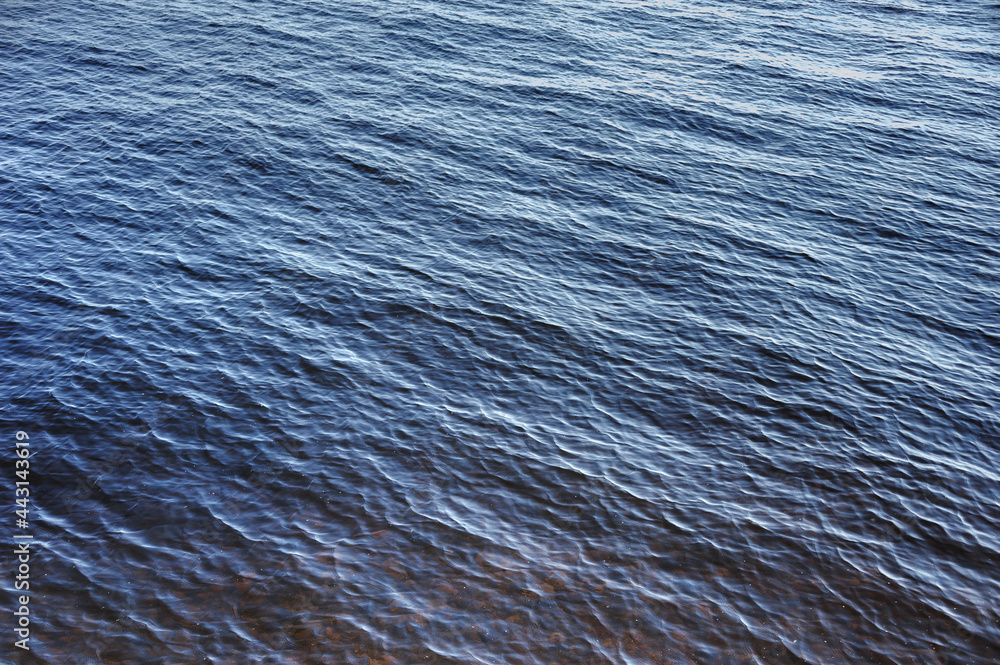 Texture of blue water near the shore Texture of blue water near the shore