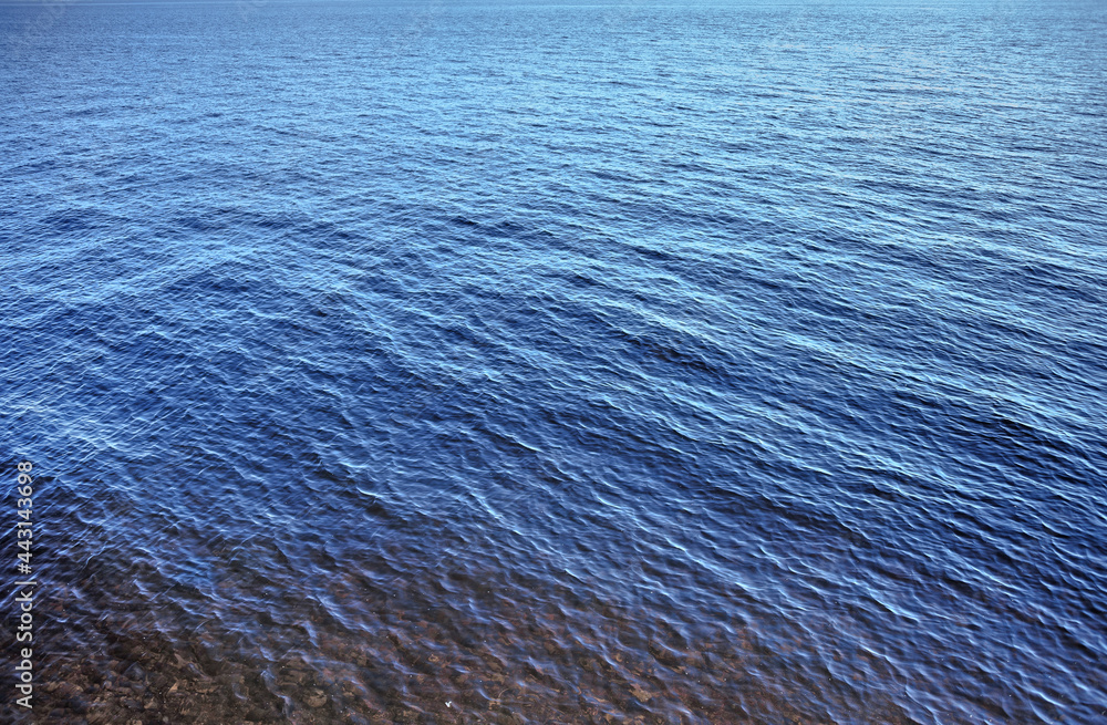 Texture of blue water near the shore Texture of blue water near the shore