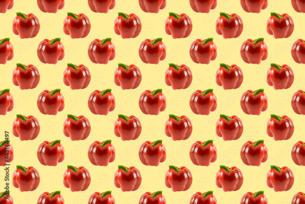 Seamless vegetable pattern of red bell peppers on yellow background. Symmetrical texture. Flat lay. Seamless vegetable pattern of red bell peppers on yellow background. Symmetrical texture. Flat lay.