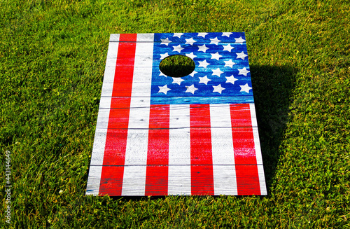 Fotografiet American Flag cornhole game on grass