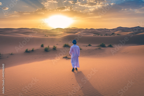 Berber man wearing traditional clothes in the Sahara Desert at dawn  Morocco