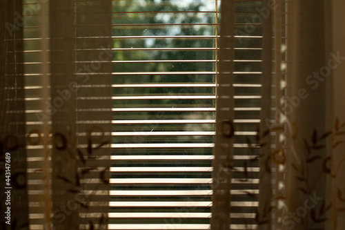 The blinds are made of wood. View of the blinds from above.