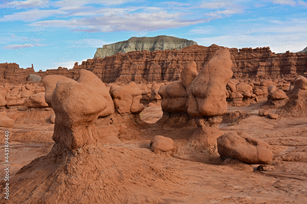 bizarre hoodoos and colorful eroded hills  at dusk  at   goblin valley state park, utah