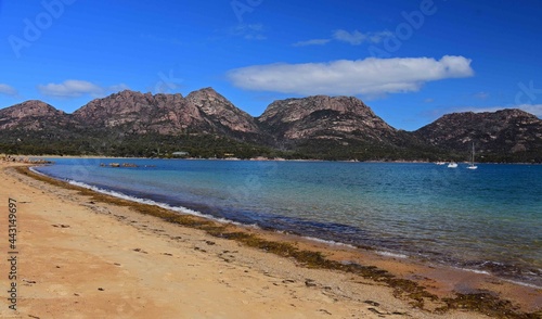 the spectacular granite mountain range of the hazards peaks overlooking honeymoon bay in freycinet national park, tasmania, australia
