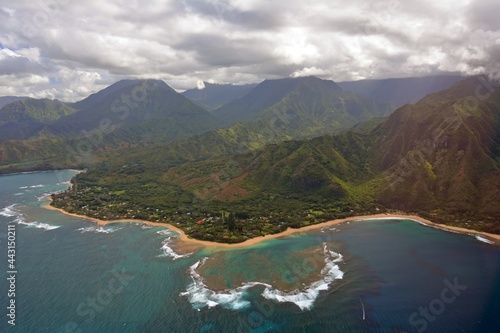 the town of princeville and coral reefs on the north shore of  kauai, hawaii, as seen from a helicopter photo