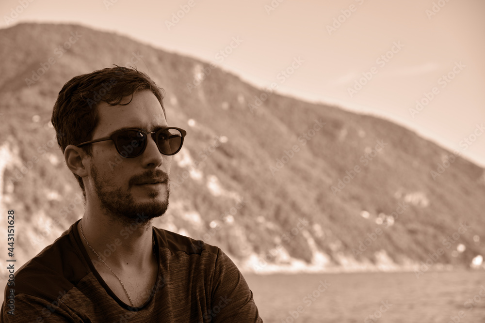 young model men wearing sunglasses on the beach young model men wearing sunglasses on the beach