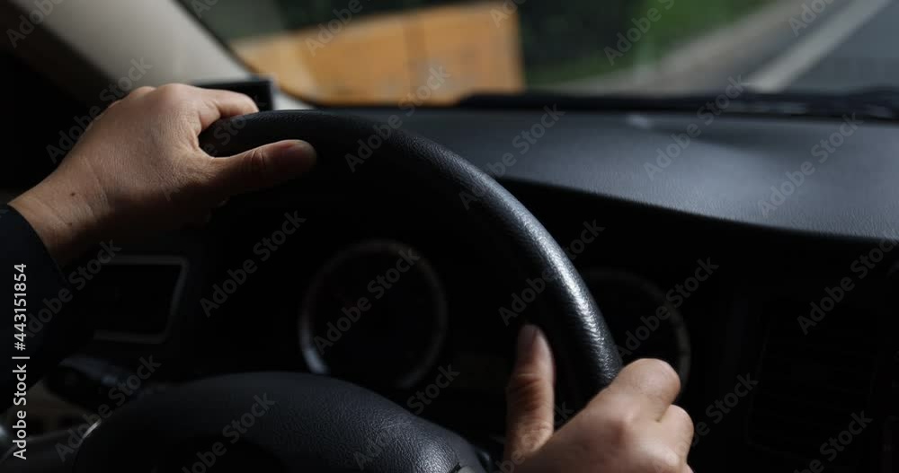Driving car on city road, hands holding the steering wheel. Driving car on city road, hands holding the steering wheel.