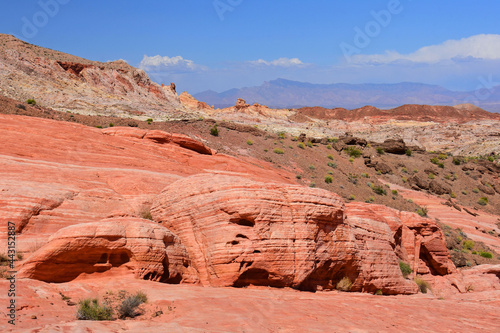 hiking along the eroded and colorful sandstone of the fire wave trail in valley of fire state park, near overton, nevada