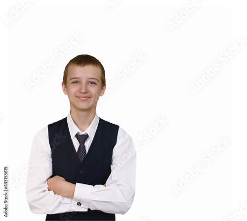 Teenager in school uniform smiles on white background