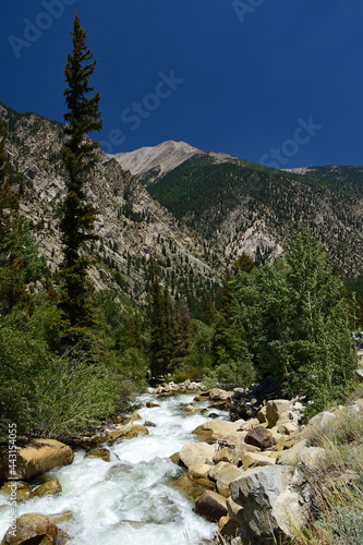 spectacular Mountain and river view at cascade falls on a sunny summer day along  tin cup pass road, near  mount princeton and nathrop, colorado photo
