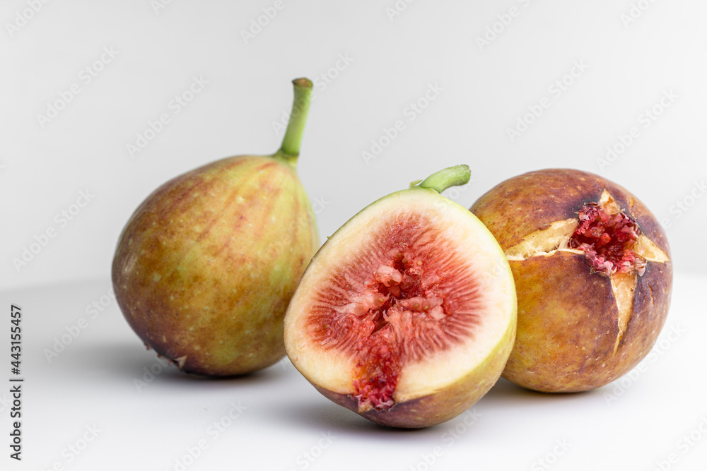 White background photo of figs cut in half. White background photo of figs cut in half.