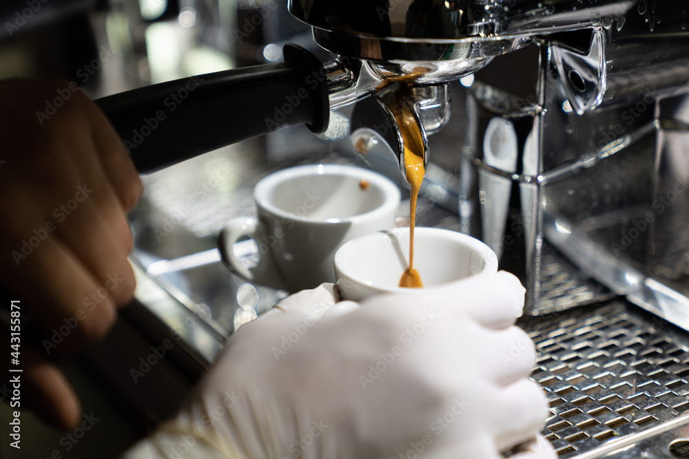 Hands Of Barista Making Coffee In Bar