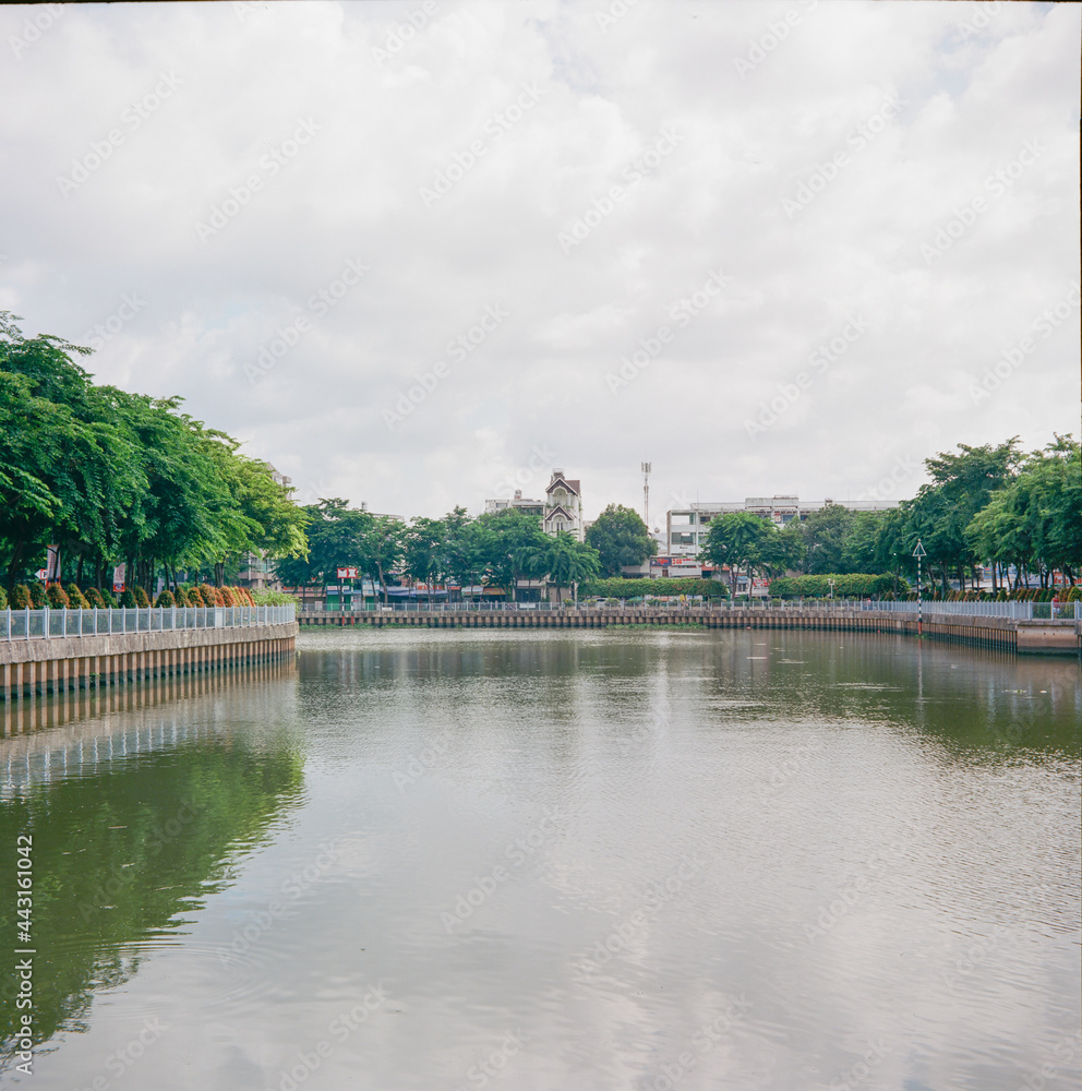 Time: June 27, 2021. Location: Ho Chi Minh City. Landscape photo: apartment building along Nhieu Loc - Thi Nghe canal (Vietnam) Time: June 27, 2021. Location: Ho Chi Minh City. Landscape photo: apartment building along Nhieu Loc - Thi Nghe canal (Vietnam)