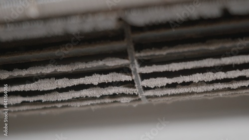 Dirty dust dense on squirrel cage fan in air conditioner indoor at home, bad maintenance conditioning need to cleaning