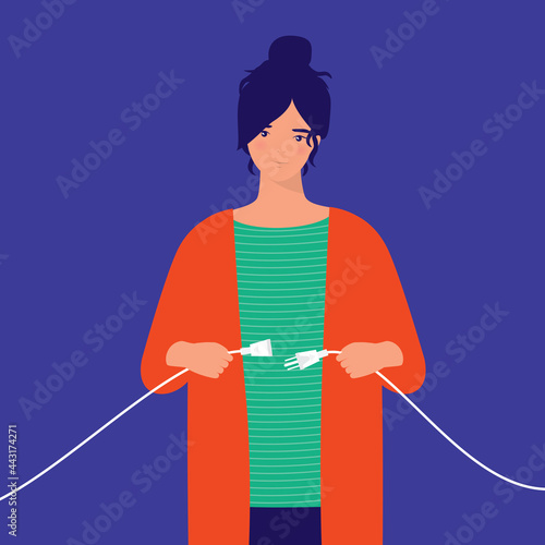 Young Smiling Woman Unplugging The Electrical Power Cable With Plug And Socket. Energy Saving. Unplugged Power Cable.