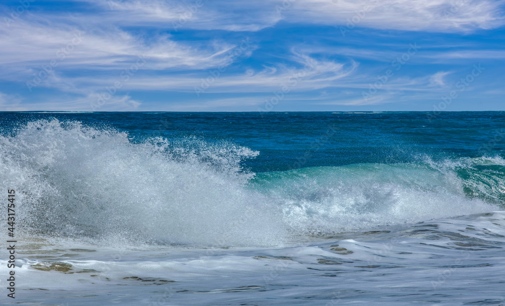 Wave crashing onto a sandy beach Perth Australia