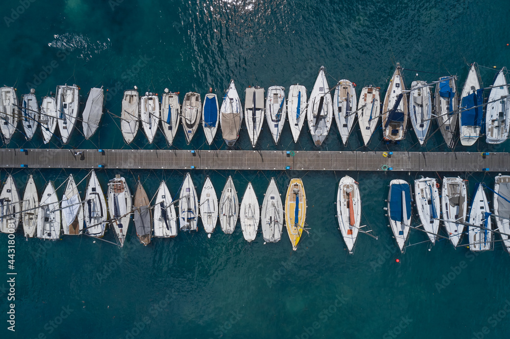 Aerial view of boats in the port. Boat parking top. Top view of sailing boats. Aerial view of boats in the port. Boat parking top. Top view of sailing boats.