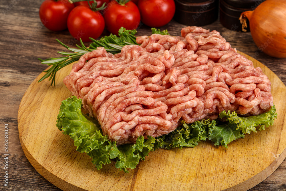 Raw pork minced meat over board Raw pork minced meat over board