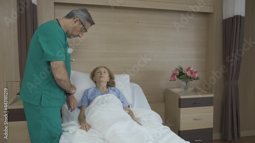 doctor check sleeping patient's pulse