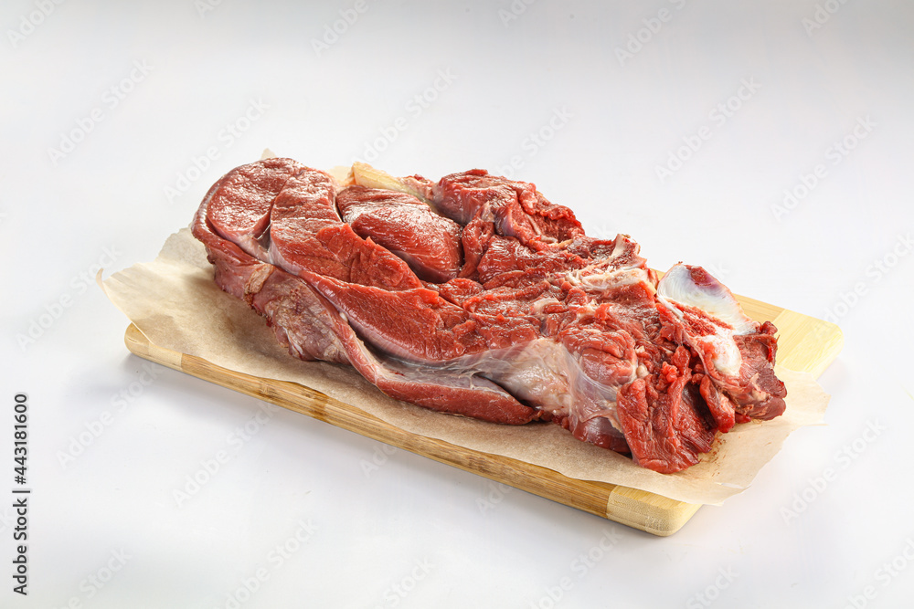 Raw beef meat over board