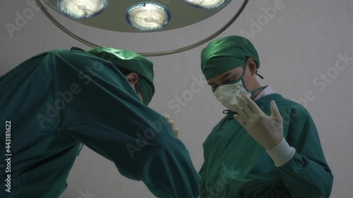 Surgeon operating chest open in surgery room