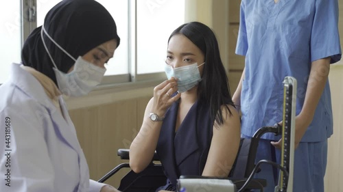 patient on wheelchair consulting with nurse