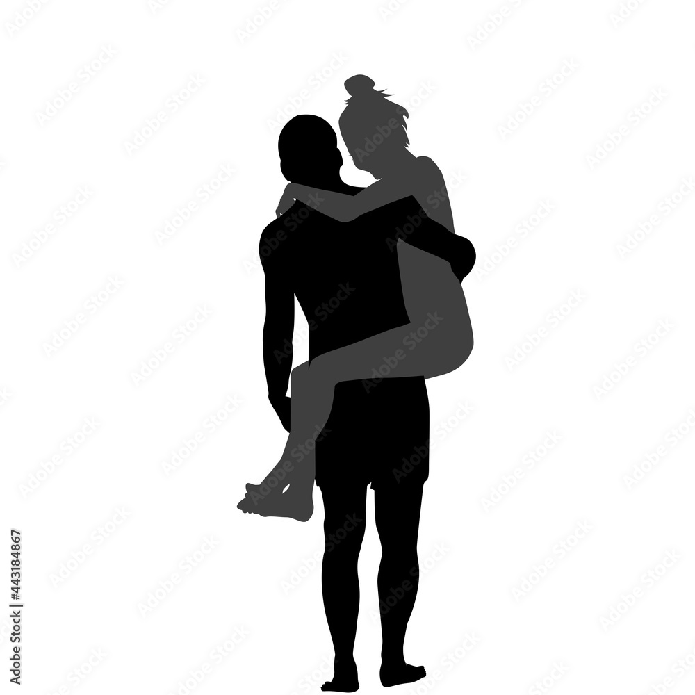 Silhouette of man carrying woman in his arms