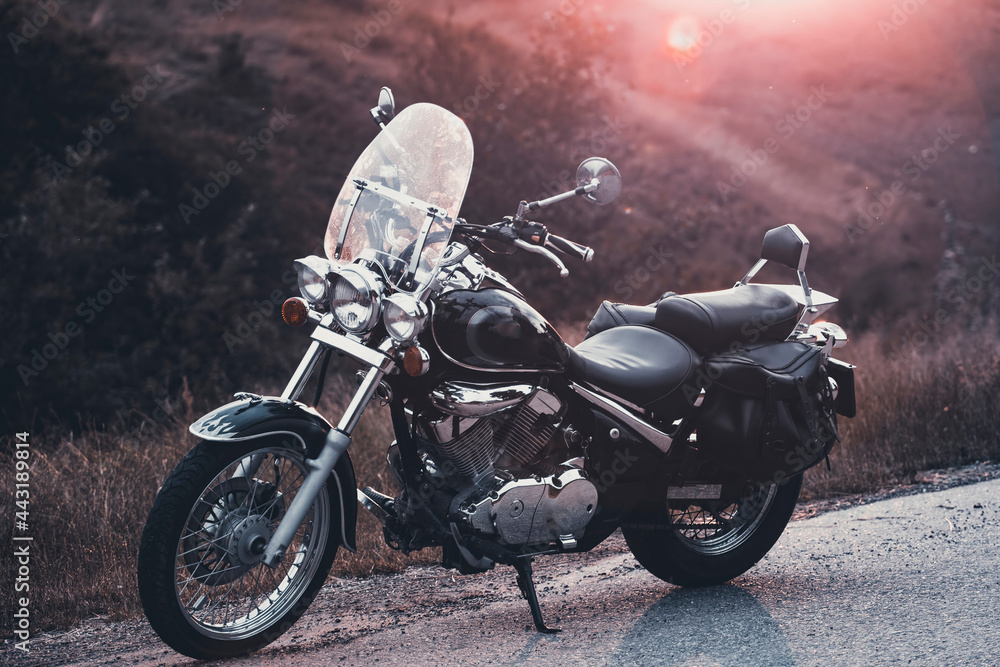 Motorcycle parking on the road right side and sunset Motorcycle parking on the road right side and sunset