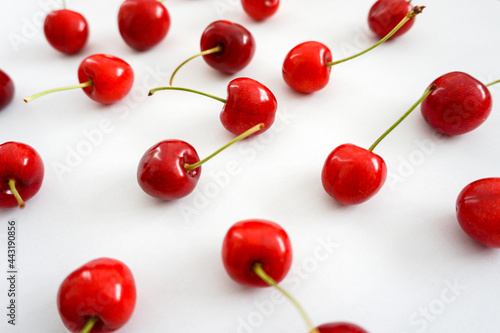 Angle view of a pattern cherry arrangments on white background