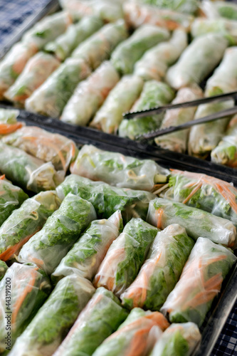 fresh thai spring rolls in tray on buffet table