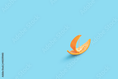 Creative summer concept with small boat made of orange peel